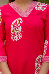 Red traditional outfit with white embroidery on a blurred background