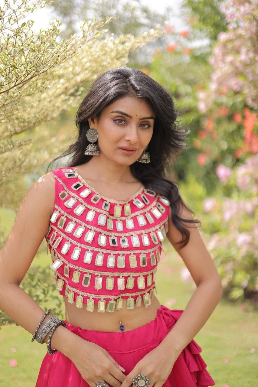 Designer festive lehenga crafted with shimmering mirror embellishments and premium fabric for a vibrant ethnic look.