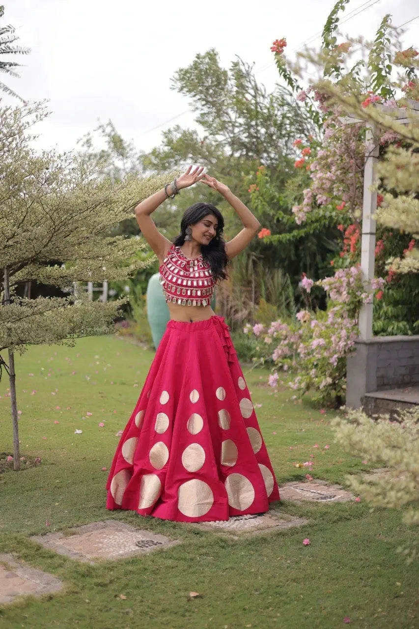 Stylish ethnic outfit combining a contemporary mirror work blouse with a graceful full-flare designer skirt.