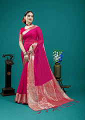 Woman in a pink saree with a teal background