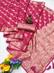 Pink saree with gold patterns, flowers, and a small statue on a white background