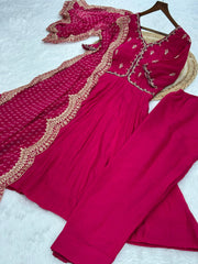 Red traditional outfit with intricate gold embroidery on a white background