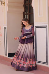 Woman in a traditional outfit with floral design standing in a decorative doorway.