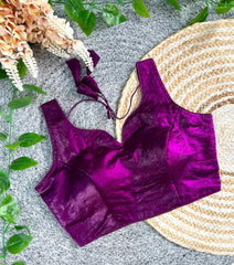 Purple velvet top on a textured surface with decorative elements