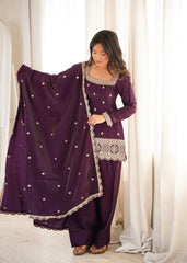 She gracefully drapes a matching sheer dupatta adorned with delicate embellishments.