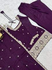 Purple traditional outfit with intricate gold embroidery on a light gray background