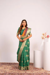 Woman wearing a green saree with a white background