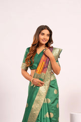Woman wearing a green saree with gold patterns on a white background