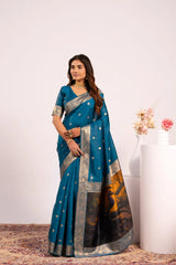 Woman wearing a blue saree with a white background