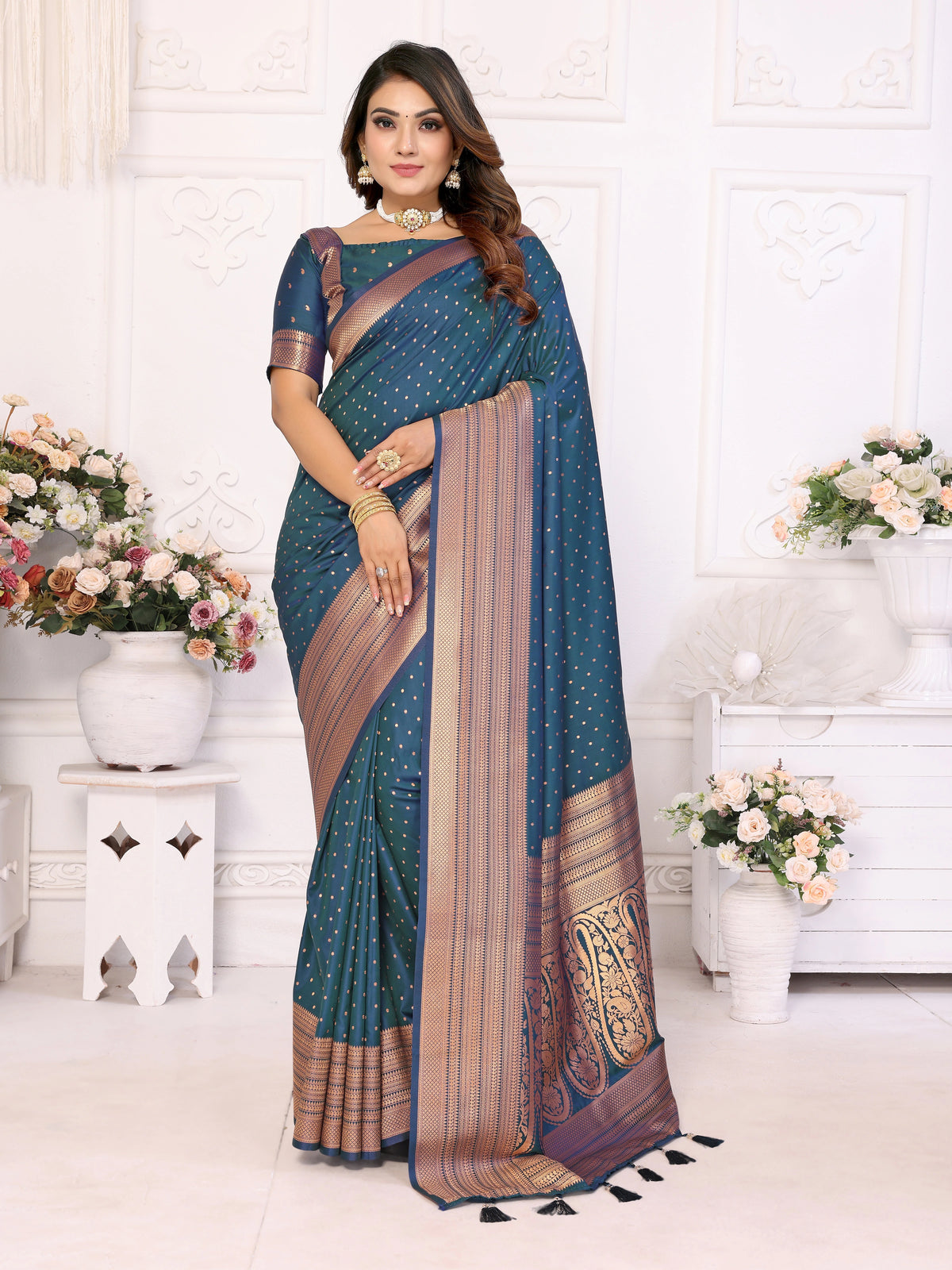 Woman wearing a blue saree with a white background