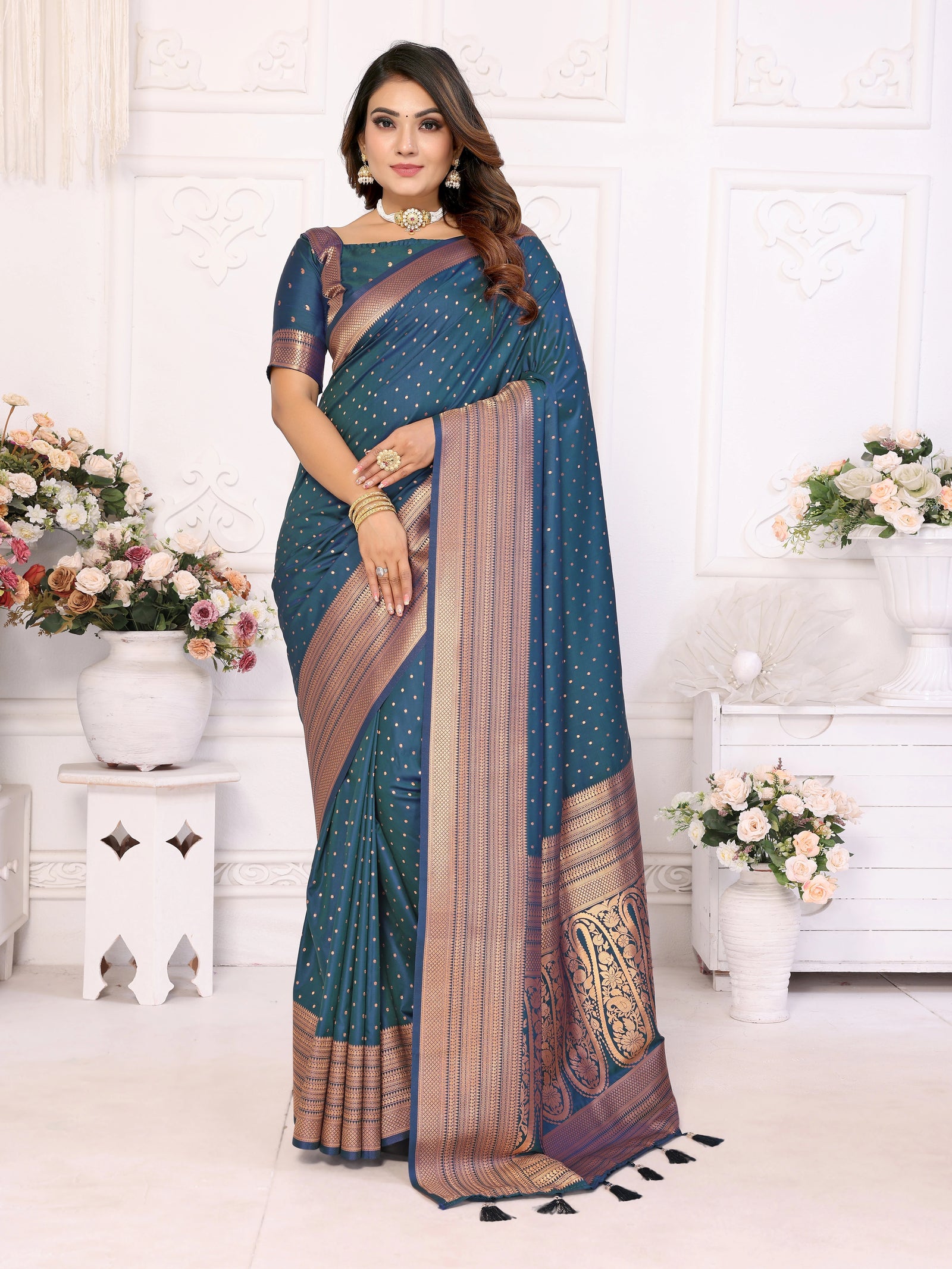 Woman wearing a blue saree with a white background