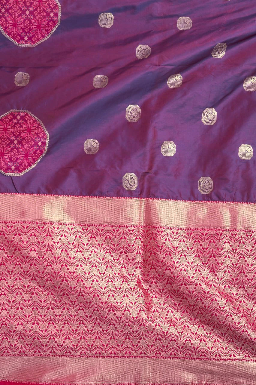 Purple and pink saree with intricate patterns