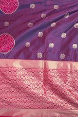 Purple and pink saree with intricate patterns