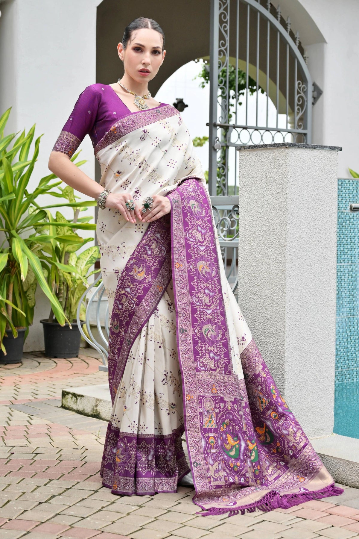 Elegant soft Banarasi silk saree in rich purple shade featuring intricate zari border and pallu