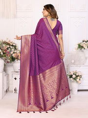 Woman wearing a purple saree with a white background