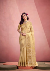 Woman in a yellow saree with a pink background