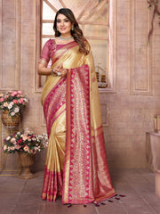 Woman wearing a traditional saree with a decorative border in a room setting.