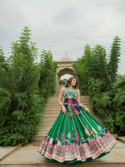 Green Digital Print Lehenga walking on garden path towards pavilion