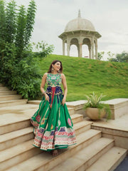 Green Digital Print Lehenga walking down garden steps near domed pavilion