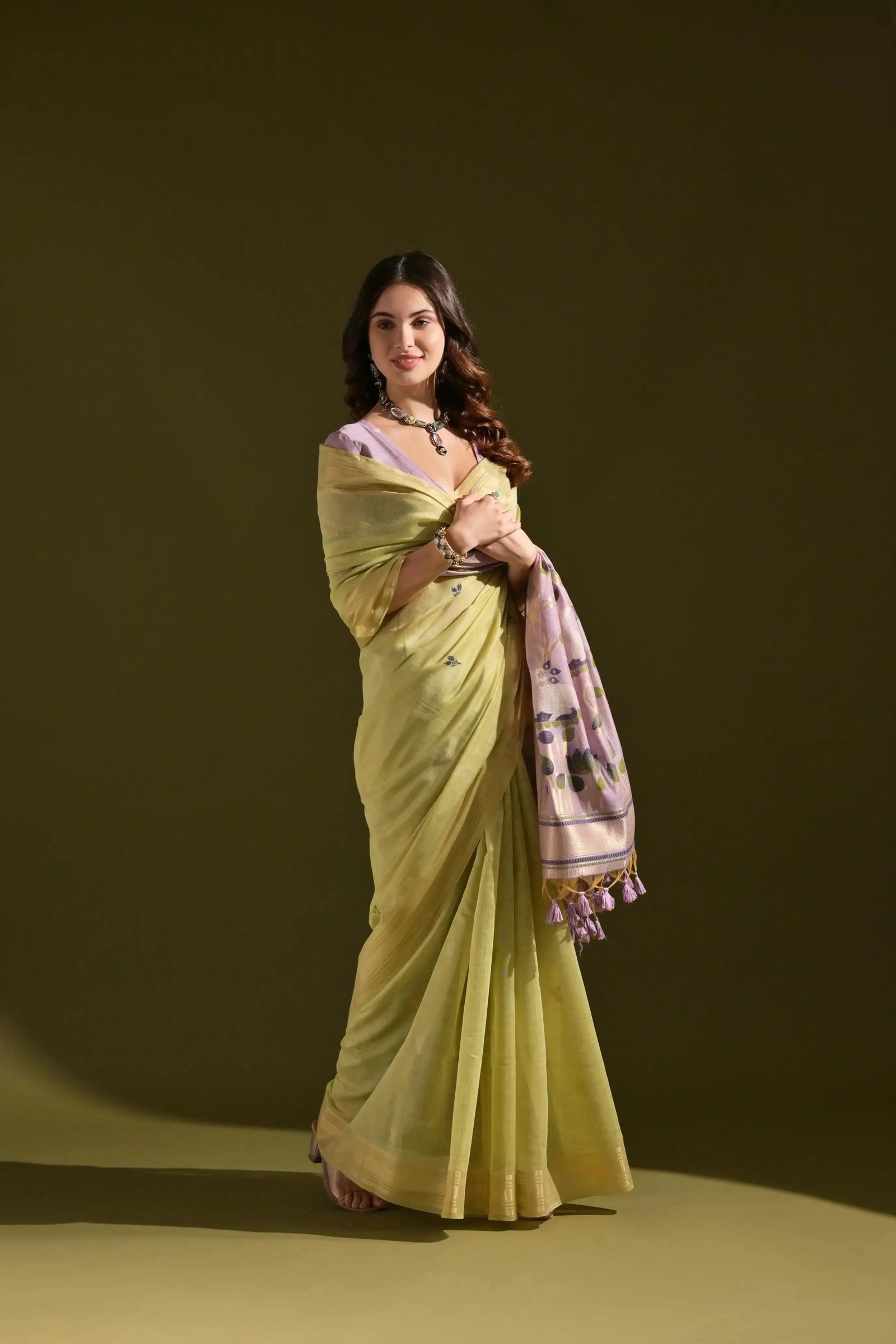 Green Resham Weaving Saree styled with lavender blouse and jewellery