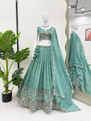 Mannequin display of full green gold crush lehenga set with choli, dupatta and Mughal hem border