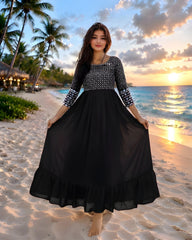 Black Embroidered Dress front view with silver diamond embroidery bodice on beach at sunset