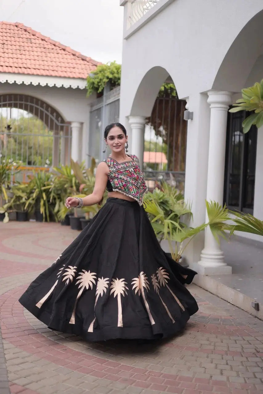 Black Gamthi Embroidered Lehenga – Model shot showing black Roman skirt with copper palm hem print and folk embroidered choli
