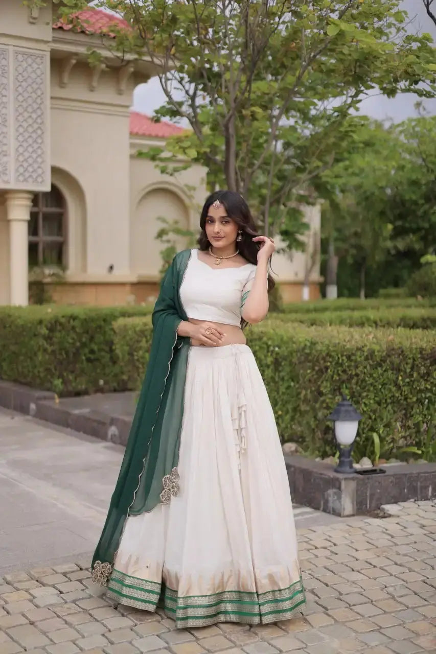 Green Zari Weaving Lehenga front view – white Viscose Jacquard skirt with green gold zari border, half sleeve choli
