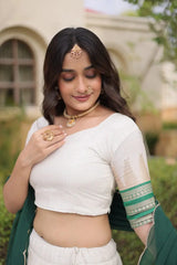 Green Zari Weaving Lehenga sleeve close-up – half sleeve choli with intricate green and gold zari band at cuff