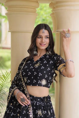 Black Bandhej Lehenga choli close-up – V-neck, short sleeves with gold zari border, sequin floral embroidery on choli