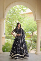 Black Bandhej Lehenga hand on hip pose – white bandhej dot print with sequins, dupatta with tassel fringe, wedding party wear