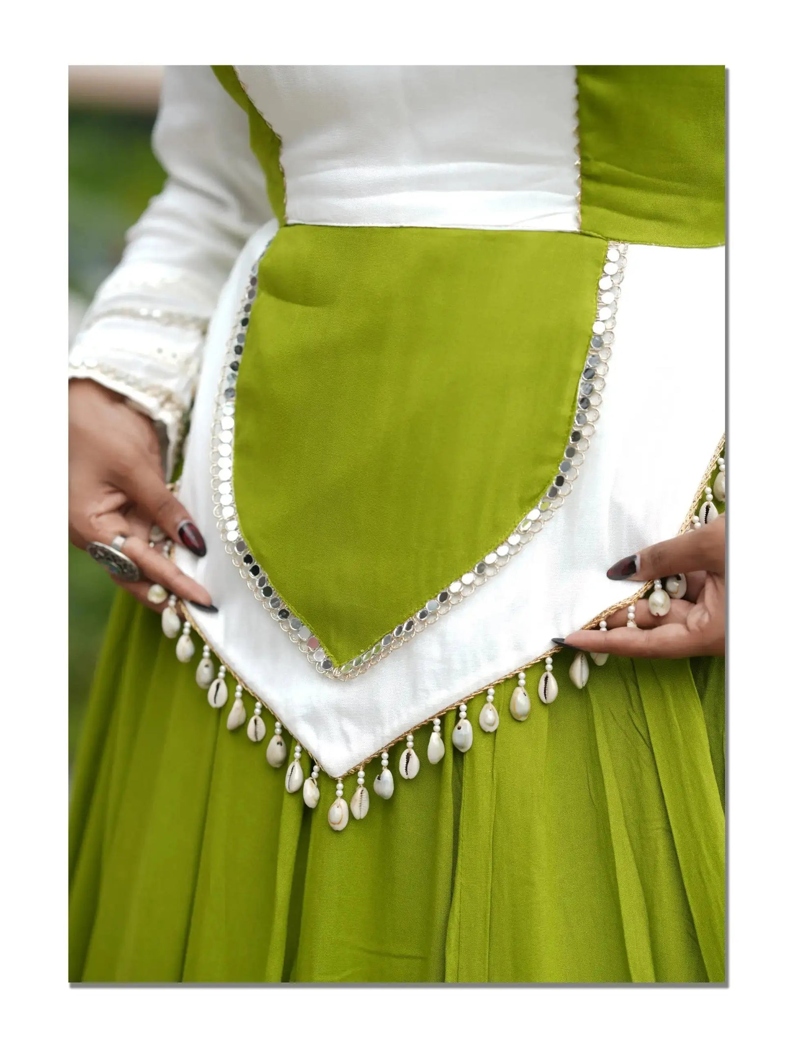 Green Mirror Lace Work Lehenga – Skirt hem close-up showing scalloped double-layer hem with sequin lace border and contrasting underlayer