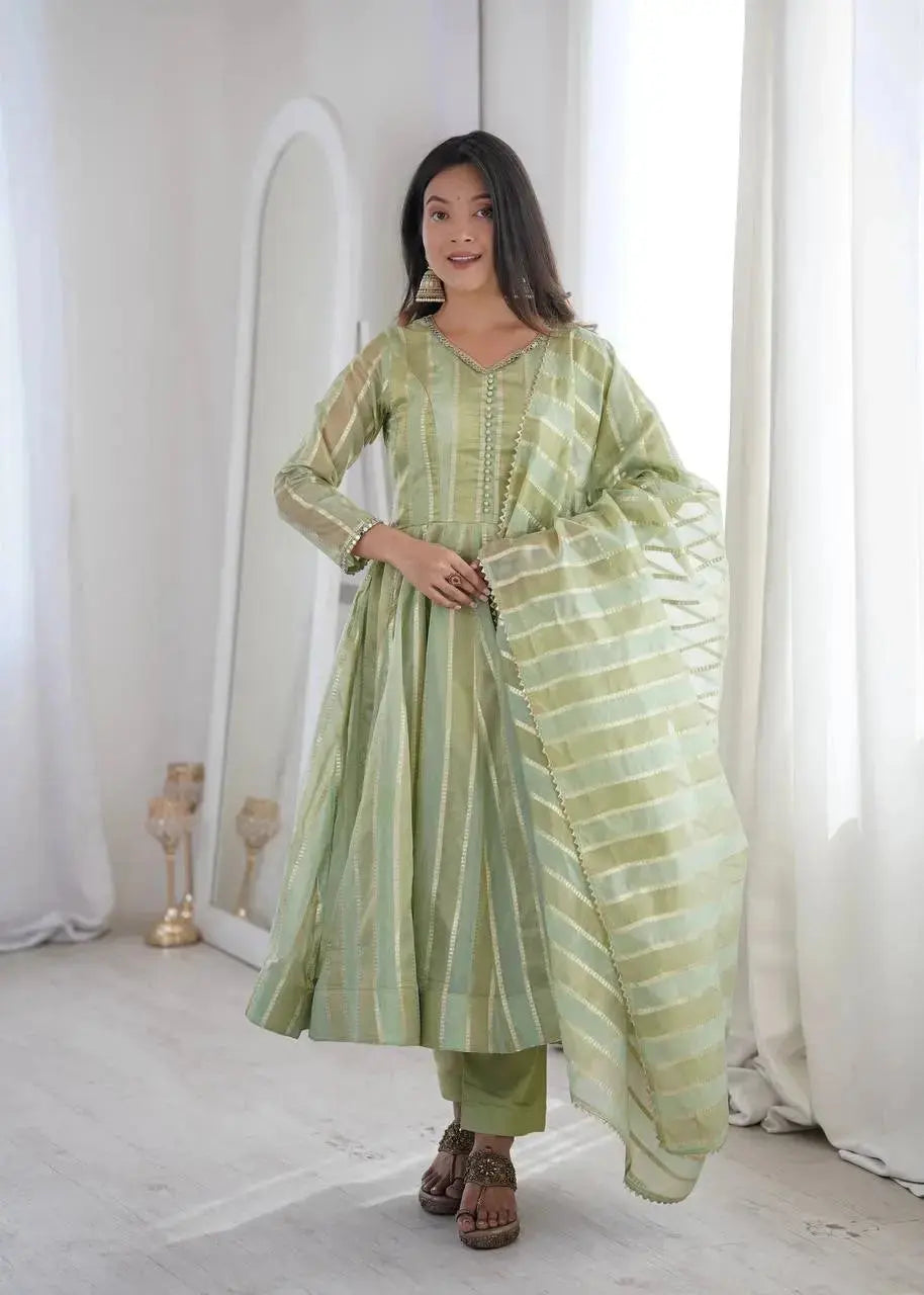 Soft pastel green mirror work anarkali suit paired with straight pants - front pose