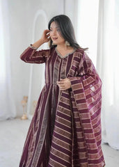 Close-up portrait of mirror work neckline and cuff on wine anarkali suit