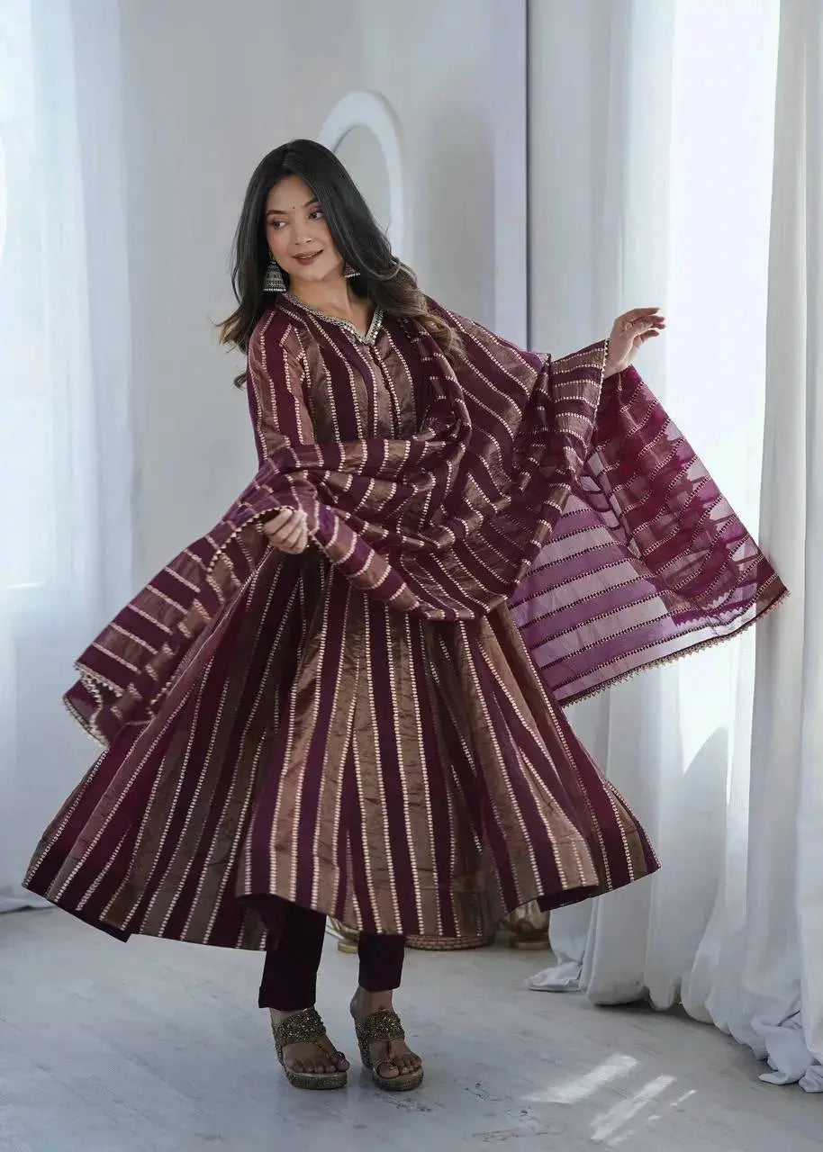 Close-up of mirror work embellished neckline on wine jacquard suit