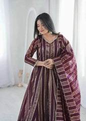 Close-up of mirror work V-neckline on wine bronze striped jacquard suit