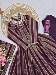 Close-up flat lay of mirror work neckline and cuff detail on wine suit