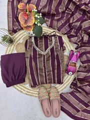 Full flat lay of wine mirror work suit set with dupatta, pants and footwear