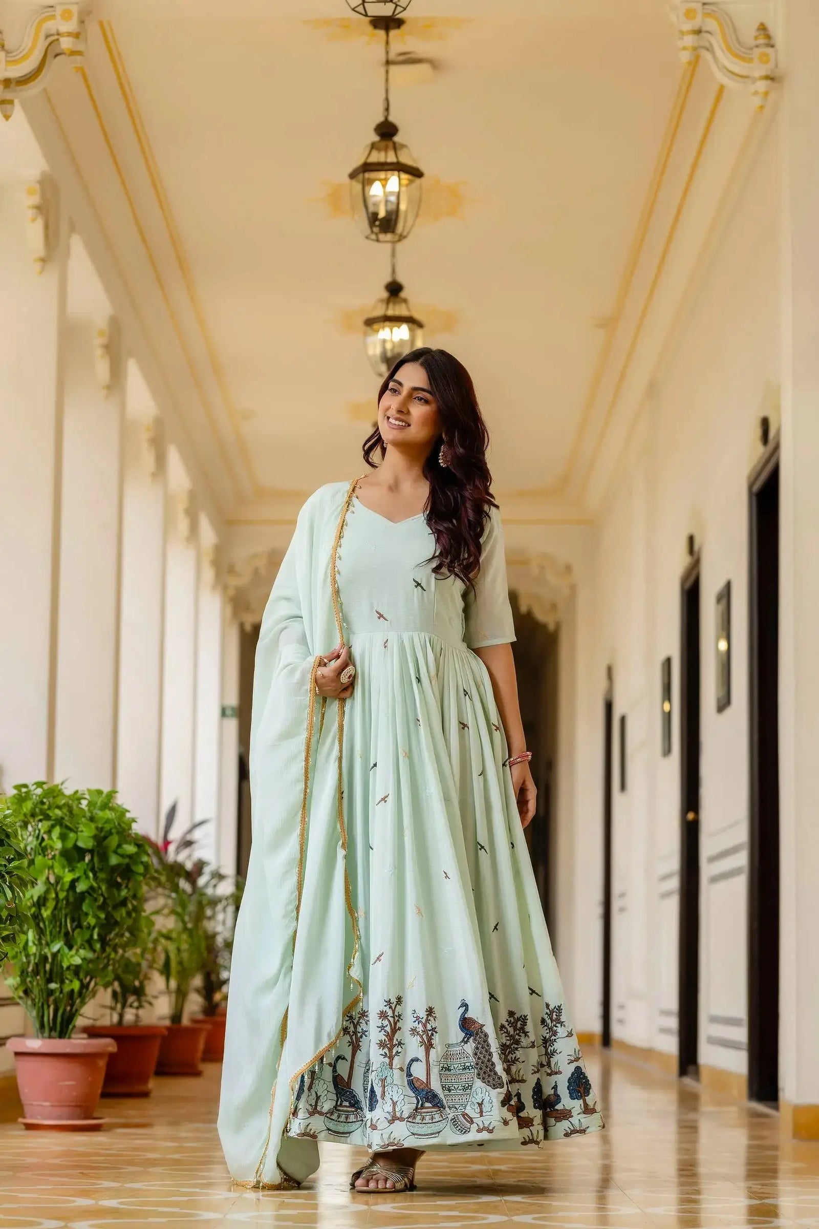 Pastel Pistachio Green Embroidered Suit Anarkali flair walking shot – Kalyanja