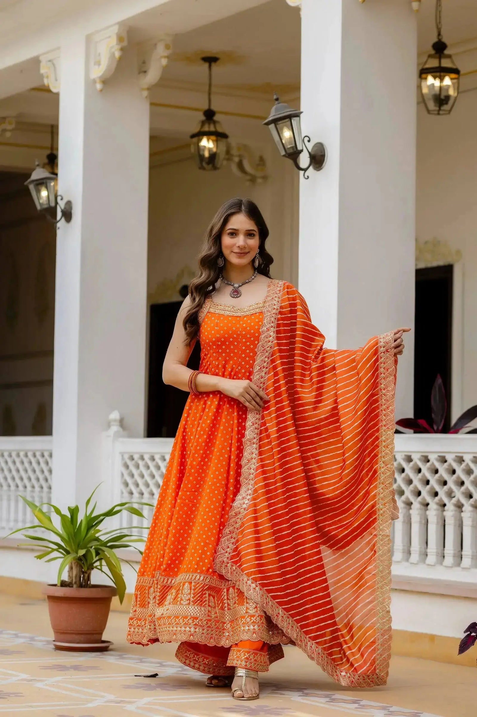 Orange Suit – gold zari temple border detail at hem