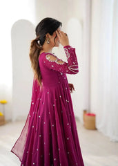 Magenta Suit – full-length third pose highlighting Anarkali flair and fancy neckline