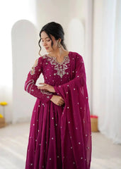 Magenta Anarkali Suit – full-length side-angle pose with dupatta flow