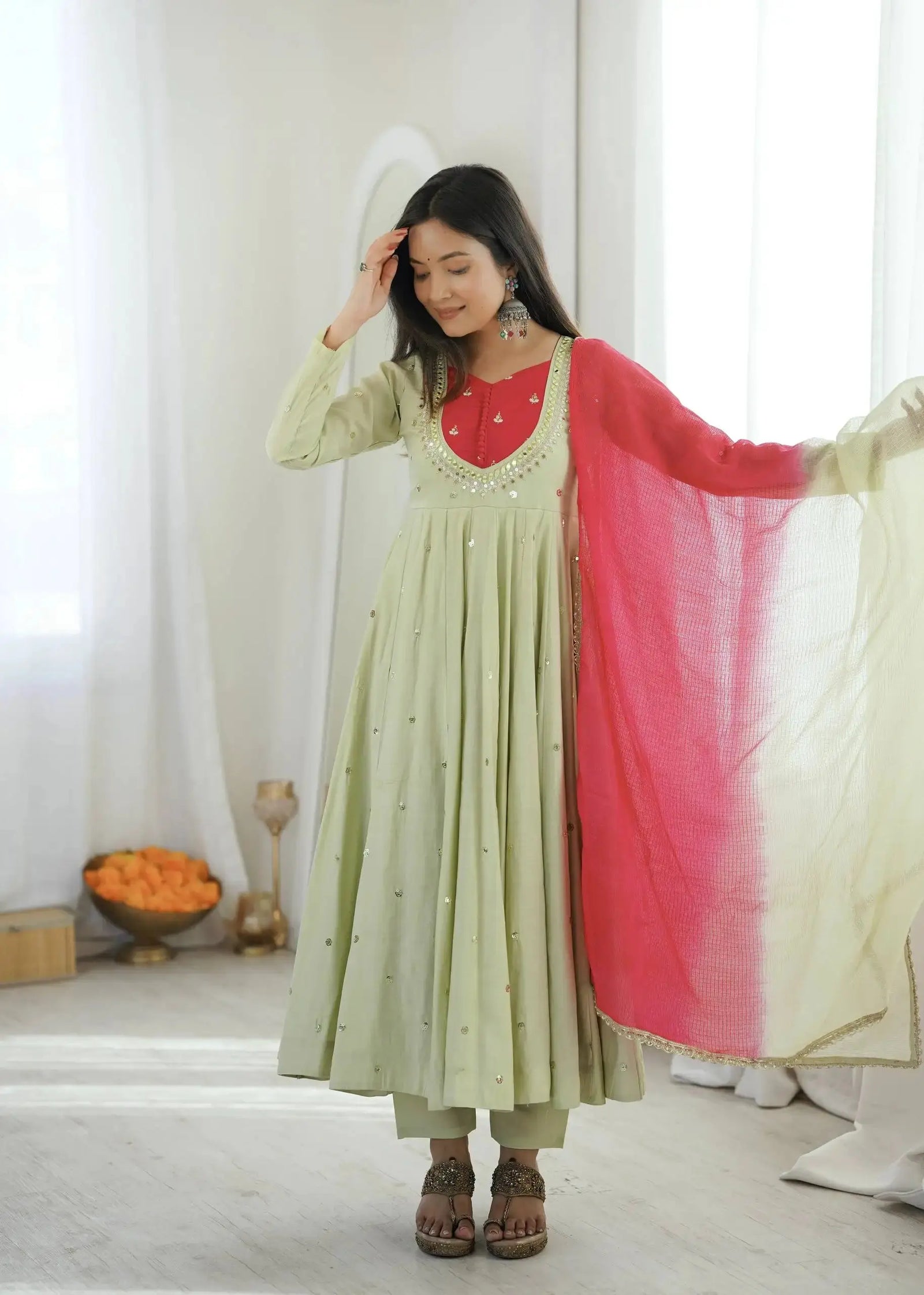 Light Pista Green Suit – scattered sequin mirror booti detail on Anarkali flair