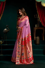 Woman wearing a colorful saree with a dark background