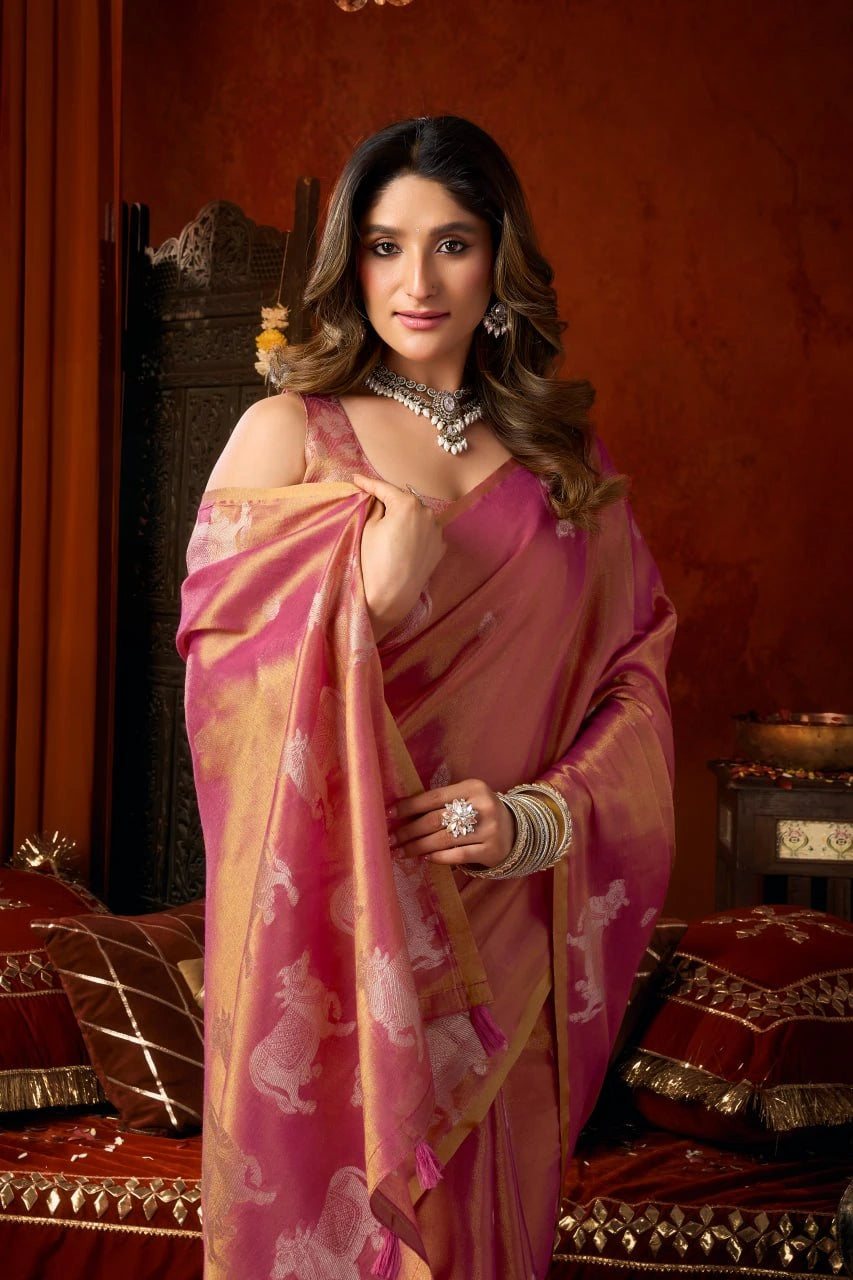 Woman in a pink saree with a decorative background
