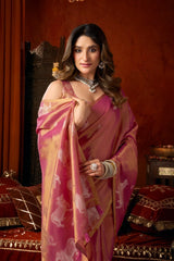Woman in a pink saree with a decorative background