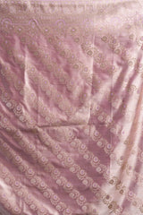 Pink fabric with intricate white patterns