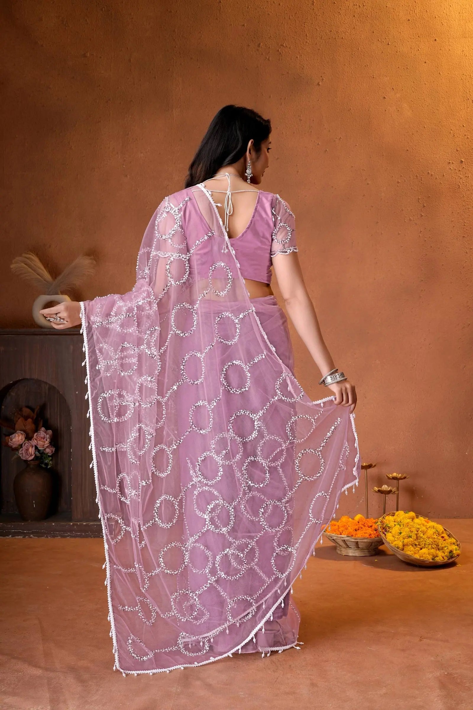 Beautiful Indian saree showcasing all-over sequins work, delicate bead detailing, and timeless traditional craftsmanship.