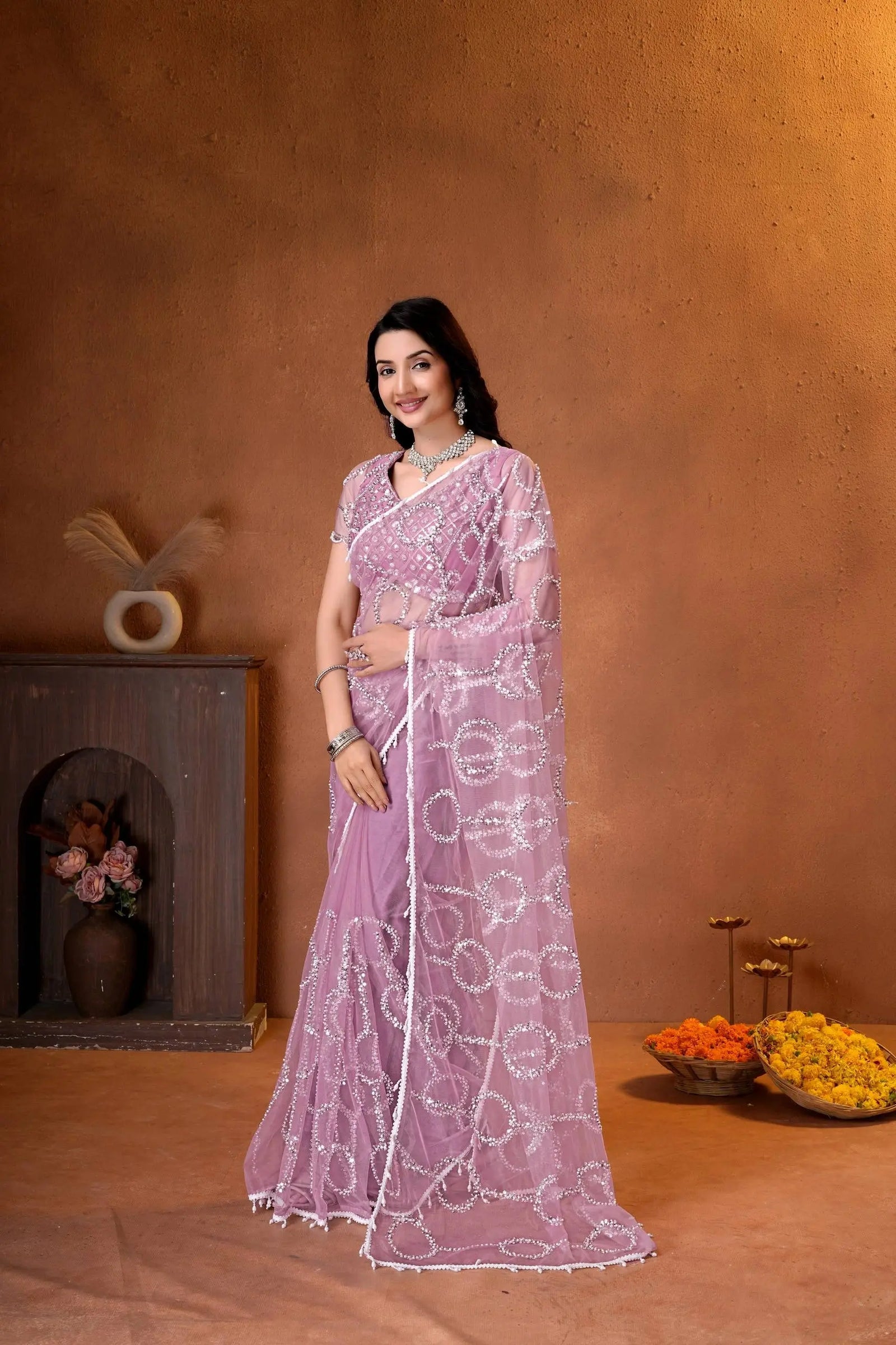 Premium party wear saree with a matching embroidered blouse, sheer embellished pallu, and luxurious ethnic styling.