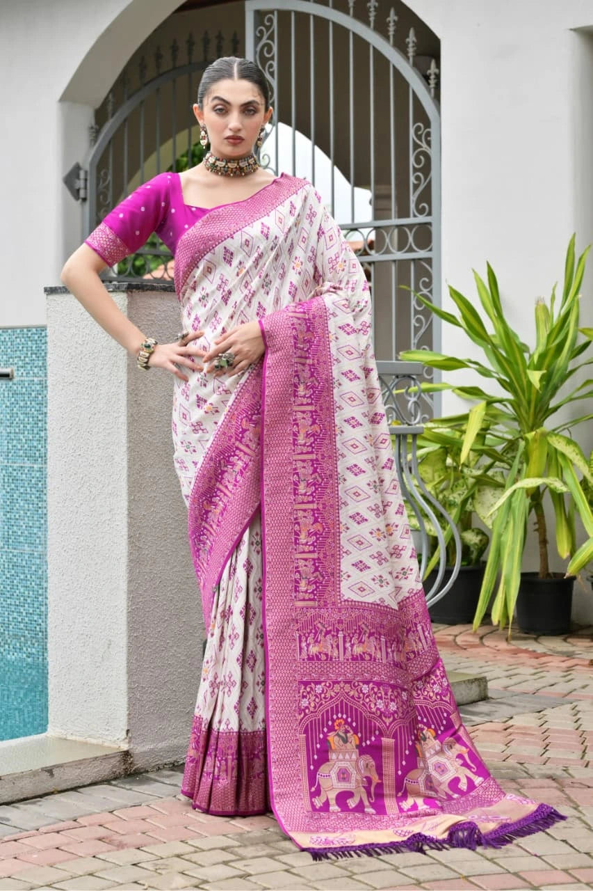 Lavender pink Banarasi silk saree with golden zari weaving displayed on mannequin.